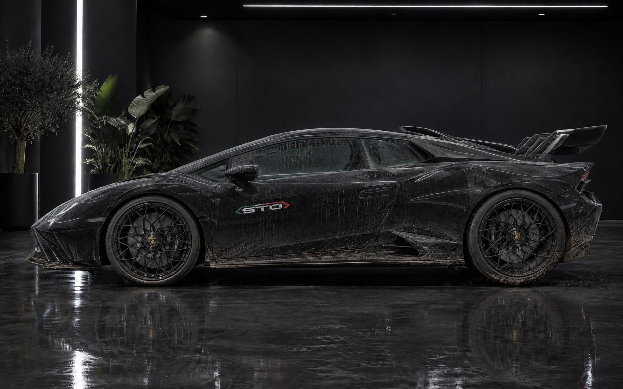 The Huracán STO before detailing, dull with road grime and brake dust
